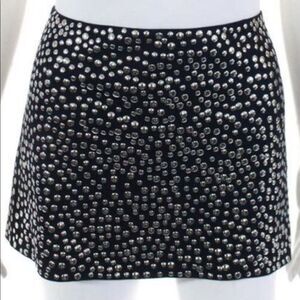 La ROK navy flat studded mini skirt.